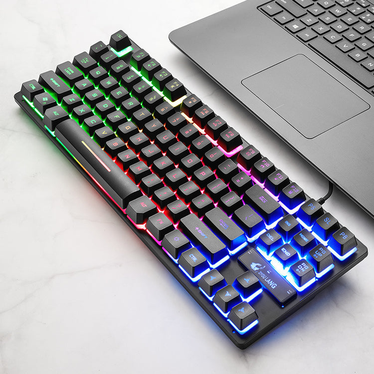 Electronic Games Mechanical Keyboard Notebook Keyboard with RGB lighting and USB interface on a marble surface.